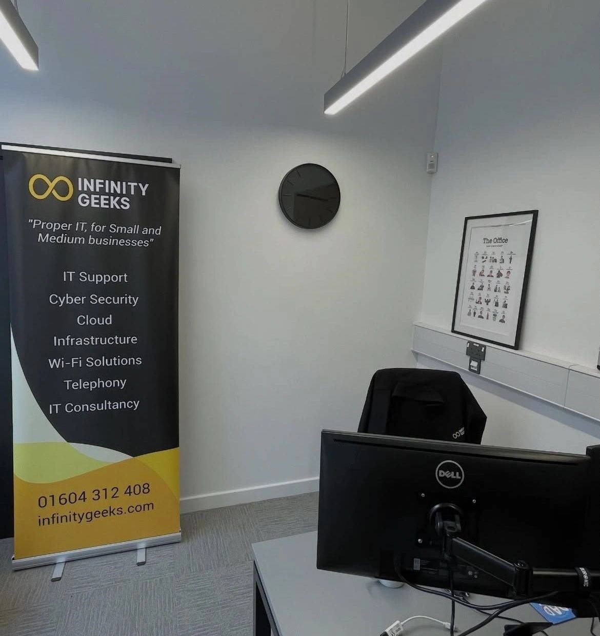 Infinity Geeks office in Northampton with branded roll-up banner